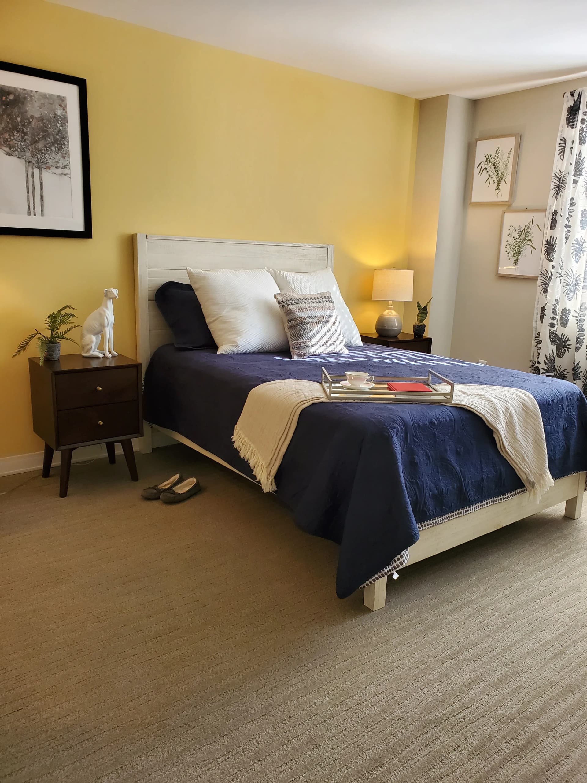 Thoughtfully staged bedroom with layered textiles and a warm, personal tone